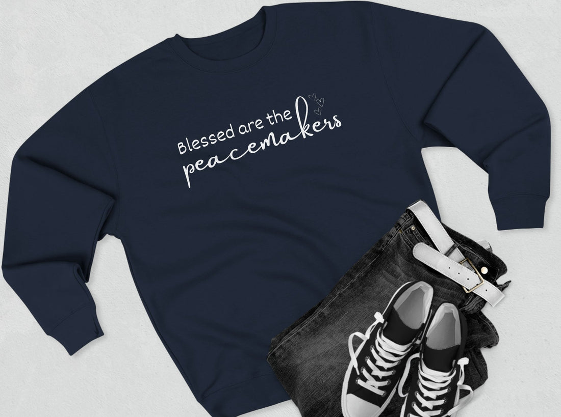 Blessed are the Peacemakers, Unisex Crewneck Christian Sweatshirt laying flat navy blue